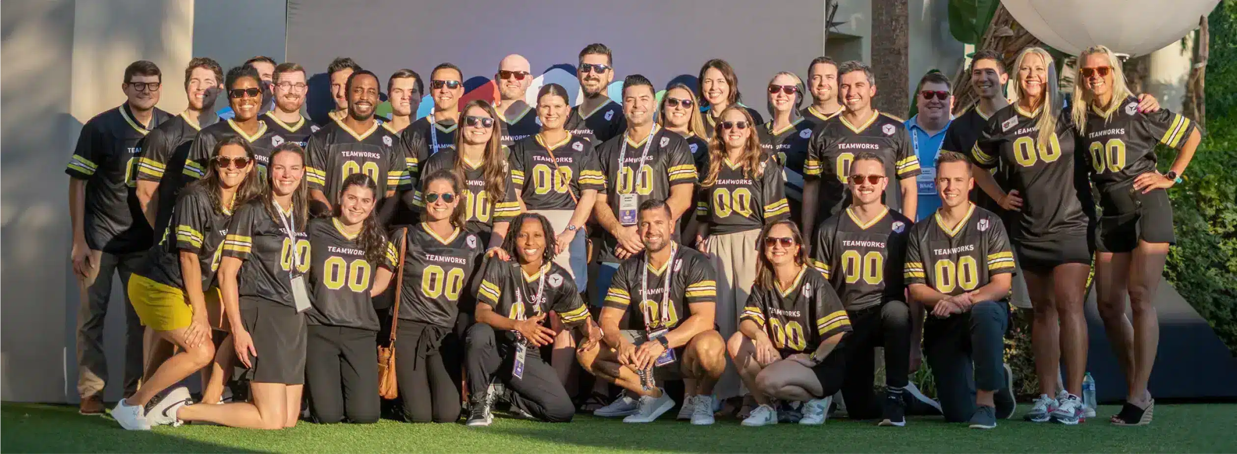 Teamworks employees posing together at the 2023 NACDA event.